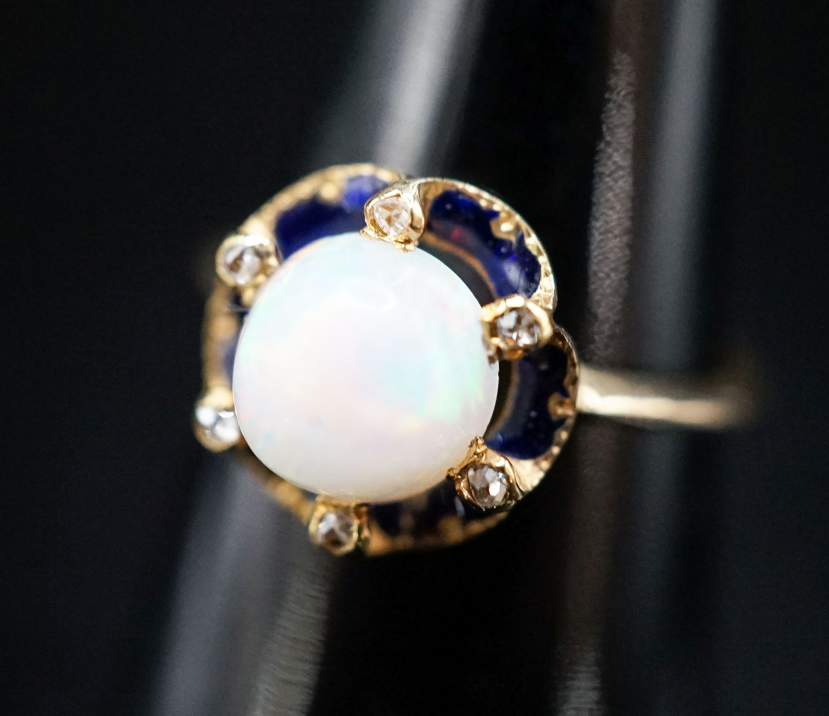 An 18ct, blue enamel, diamond chip and opal set dress ring, size R, gross weight 4.3 grams.